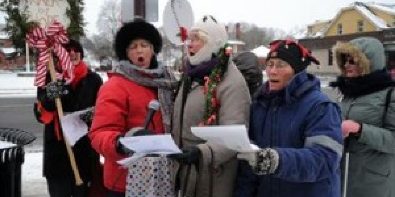 Members of the walk singing a christmas carol